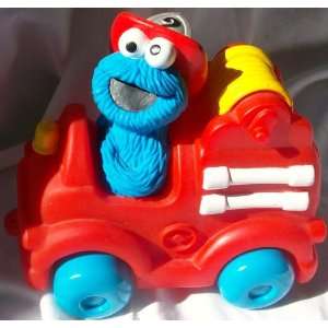    Sesame Street Cookie Monster Rubber Fire Truck Toy: Toys & Games