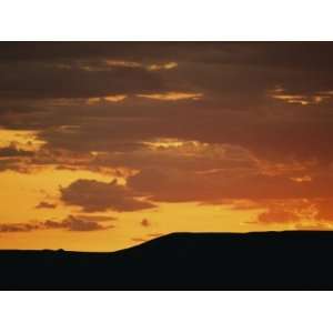  Low Sunlight Colors the Sky and Clouds in Shades of Orange 