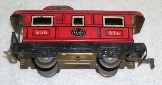vintage 8 INCH WINDUP LOCOMOTIVE AND FOUR CARS AND 11 PIECES OF TWO 