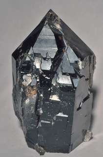 This statuesque Smokey Quartz cathedral point is a deep burned 
