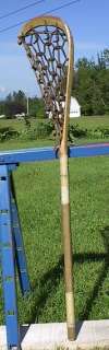 is a vintage wooden lacrosse stick. Measures 40 long. The lacrosse 